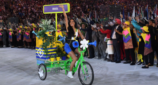A woman on a bicycle leads the Brazil delegation during the opening ceremony of the Rio 2016 Olympic Games at the Maracana stadium in Rio de Janeiro on August 5, 2016. / AFP / Leon NEAL (Photo credit should read LEON NEAL/AFP/Getty Images)